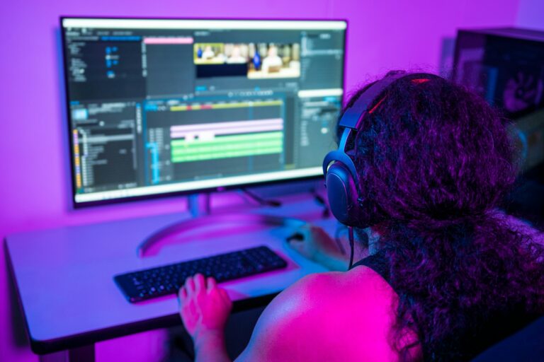 Person working from home at night. Video editor editing a commercial.